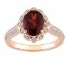 Stella Grace 14k Rose Gold Garnet & 1/6 Carat T.W. Diamond Vintage Halo Engagement Ring